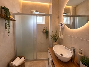 Standard Room, Garden View | Bathroom | Shower, hair dryer, slippers, towels - The One Alacati (Cesme)
