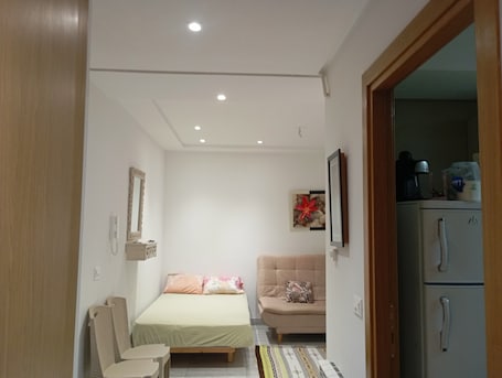 Comfort Apartment, Balcony, Garden View | Living area | 100-cm plasma TV with cable channels