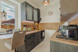 Appartement Deluxe, balcon, vue sur le jardin | Cuisine privée | Bouilloire électrique, grille-pain