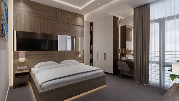 Una habitación de hotel moderna con una cama grande, un escritorio y un baño.