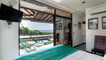 Habitación doble Confort, 1 cama King size, vista al océano | Caja de seguridad en la habitación y cortinas blackout