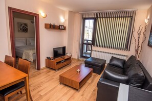 Standard Apartment, 1 Bedroom, Mountain View | Living area | 32-inch LCD TV with cable channels, toys, books - Aparthotel Orbilux (Bansko)