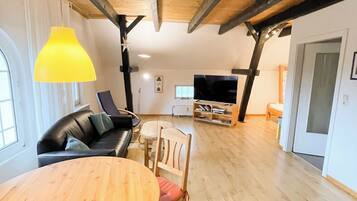 Panoramic Condo, Garden View | Living area | 100-cm flat-screen TV with satellite channels