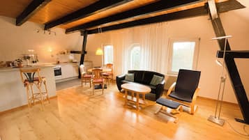 Panoramic Condo, Garden View | Living area | 100-cm flat-screen TV with satellite channels