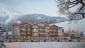 A multi-story hotel with balconies, large windows, and a ski slope in the background. - Apartment in Berwang With Ski-in/ski-out (Berwang)