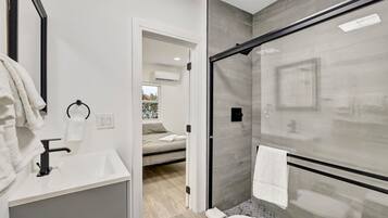 Deluxe Condo, 1 Bedroom, Non Smoking, Patio | Bathroom | Shower, free toiletries, hair dryer, towels