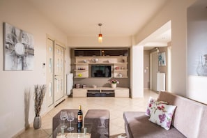 Living area - Sunshine sea view holiday home apartment in charming Koutouloufari village. (Koutouloufari)
