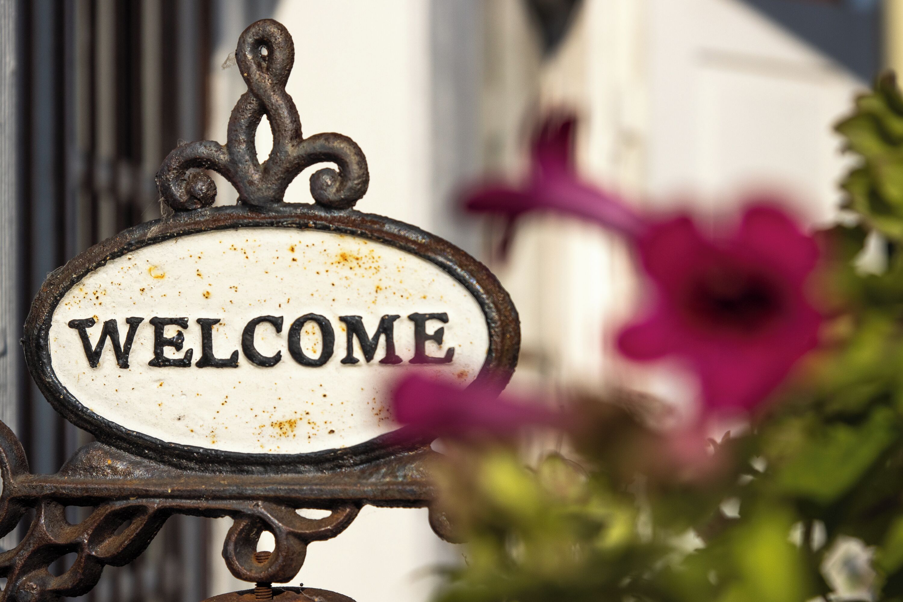 A metal sign with the word "WELCOME" on it.