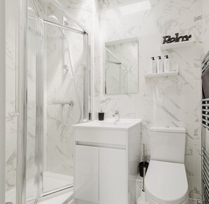 Shower, hair dryer, towels, soap