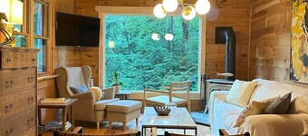 Real log cabin in the forest with modern amenities for the nature lover