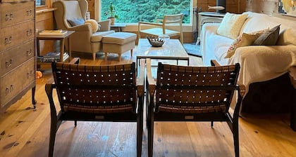 Real log cabin in the forest with modern amenities for the nature lover