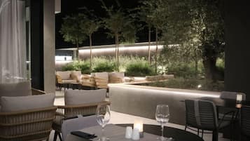 Enjoy al fresco dining amidst lush greenery and a serene atmosphere.