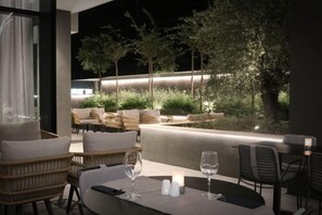 Enjoy al fresco dining amidst lush greenery and a serene atmosphere.