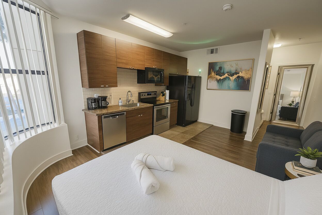 A modern kitchen with wooden cabinets, a refrigerator, and a microwave.