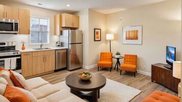 Deluxe Apartment, 3 Bedrooms | Living area | 55-inch Smart TV with digital channels, Netflix, streaming services