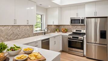 Deluxe Apartment, 2 Bedrooms | Private kitchen | Full-size fridge, microwave, oven, stovetop