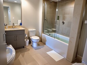 Apartment, 2 Bedrooms | Bathroom | Combined shower/tub, rainfall showerhead, hair dryer, towels