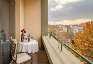 Enjoy a romantic dinner for two on this balcony overlooking the city's historic skyline and vibrant autumn foliage.