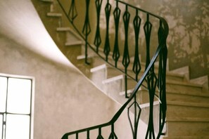 A staircase with a unique metal railing design. - Mona Athens (Athens)
