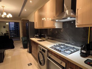 Microwave, oven, stovetop, dishwasher - Luxury Downtown Studio - Burj Khalifa View Balcony (Dubai)