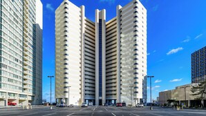 A modern high-rise building with a central atrium and multiple floors. - 2BR Atlantis, Family Friendly, 16th fl Oceanfront Views, Outdoor Oceanfront Pool (Ocean City)