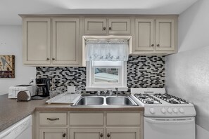 Fridge, microwave, stovetop, coffee/tea maker