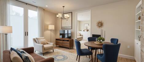 Departamento, 2 habitaciones | Área de sala de estar | Smart TV de 55 pulgadas con canales digitales y Netflix