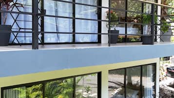 Deluxe Room, Balcony, Garden View | In-room safe, desk, laptop workspace, blackout drapes