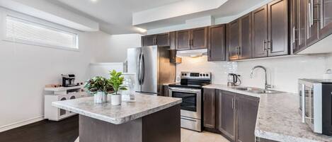 Fridge, microwave, stovetop, coffee/tea maker