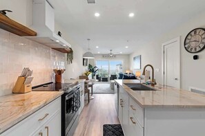 Fridge, microwave, oven, stovetop - Beach, You Crazy! by Carolina Getaway- Oceanfront 2BR Condo POOL & HOT TUB OPEN (Carolina Beach)