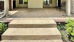 A covered patio with a ceiling fan, a concrete staircase, and a brick wall. - Spacious 4 Bed Island House on Lake Hamilton with Boat Slip (Hot Springs)