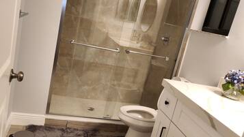 Shower, hair dryer, towels, soap