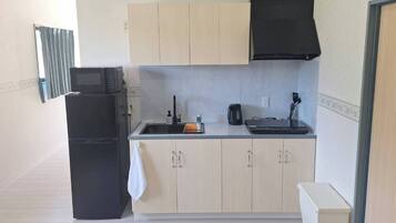 Villa, Ocean View | Private kitchen | Fridge, stovetop, cookware/dishes/utensils, freezer