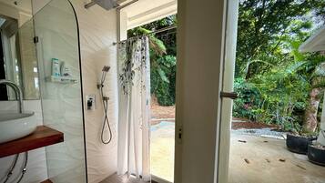 Shower, hair dryer, towels, soap