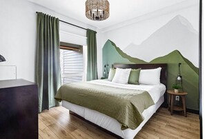 1 bedroom, desk, iron/ironing board, travel crib