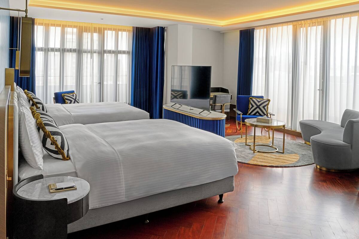 Luxury Twin Room, City View | Free minibar items, in-room safe, desk, laptop workspace
