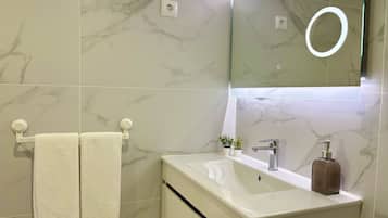 Hair dryer, towels, soap, toilet paper