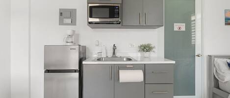 Fridge, microwave, coffee/tea maker, dining tables