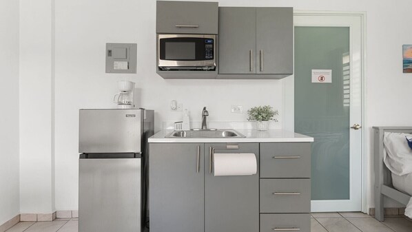 Fridge, microwave, coffee/tea maker, dining tables