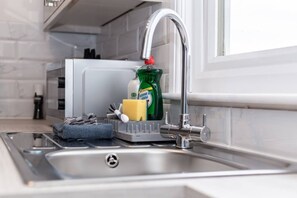 Fridge, microwave, oven, stovetop - Coastal Charm 1BR Flat near the Sea Street Parking (Hastings)