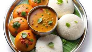 A traditional South Indian meal with idlis, dosas, and a bowl of sambar. - 4 U BUSINESS CLASS (Chennai)