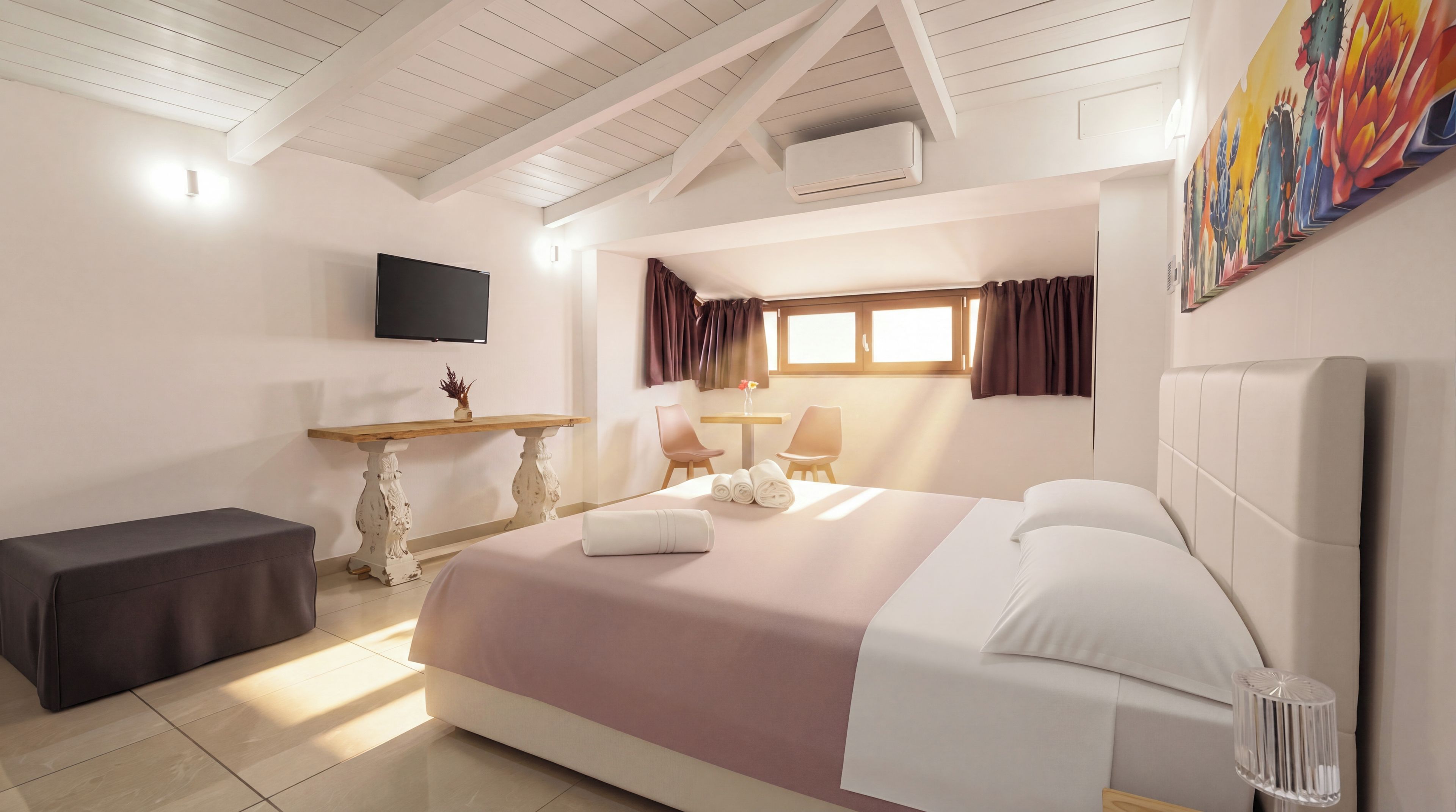 A hotel room with a bed, a desk, a chair, a television, and a window with curtains.