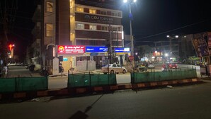 A hotel with a prominent sign for 'CKM Tower Inn Boutique Hotel'. - Shri Sai Palace inn (Chikkamagaluru)