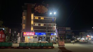 A multi-story hotel with signage for 'CKM Town Inn' and 'Shri Sai Palace Inn'. - Shri Sai Palace inn (Chikkamagaluru)