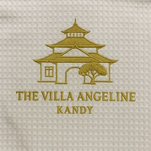 A logo with a pagoda-style building and a tree, and the text "THE VILLA ANGELINE KANDY". - The Villa Angeline (Kandy)