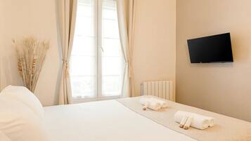 Blackout drapes, iron/ironing board, travel crib, free WiFi