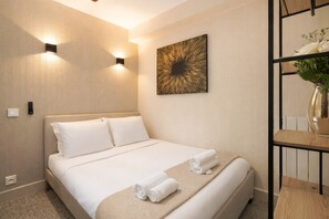 Blackout drapes, iron/ironing board, travel crib, free WiFi