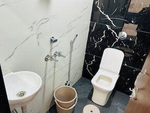 Luxury Quadruple Room | Bathroom | Shower, slippers, towels, soap - Hotel Shree (Ujjain)