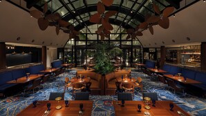 A spacious hotel lobby with a high ceiling, large windows, and a central seating area. - South Gate Hotel Okinawa Naha Tomari Port (Direct Access to Tomarin) (Naha)