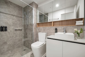 Shower, towels, shampoo, toilet paper
